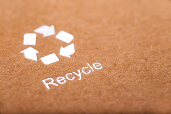 Recycle symbol on a recycled cardboard box